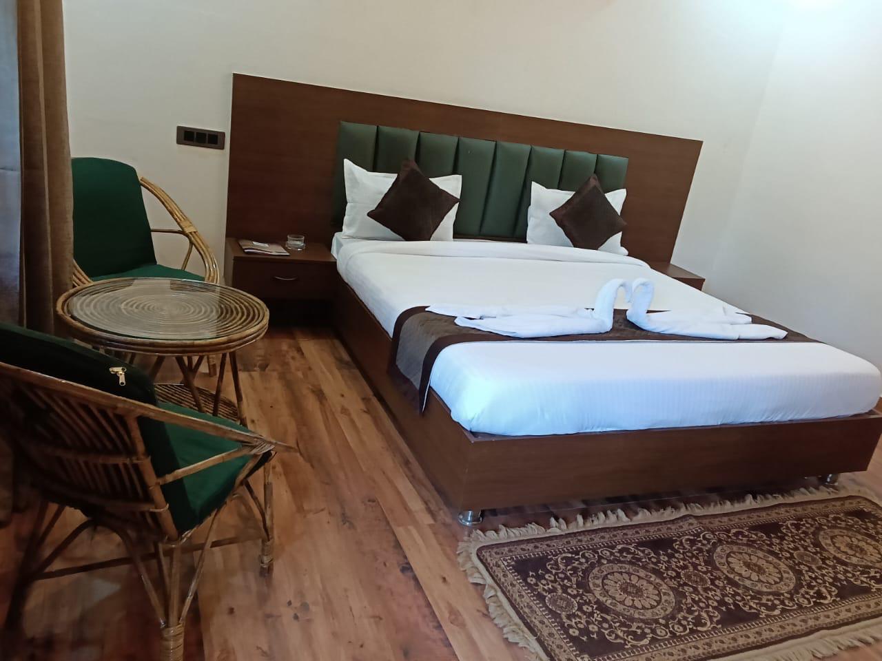 Luxury resort pool with palm trees at sunset